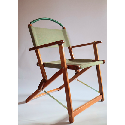 Folding chair in green material and wood frame