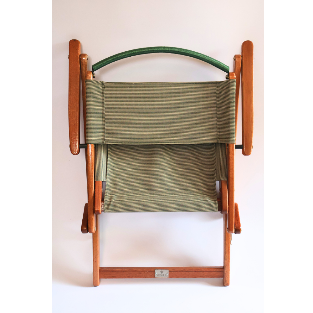 Folded chair in green material and wood frame