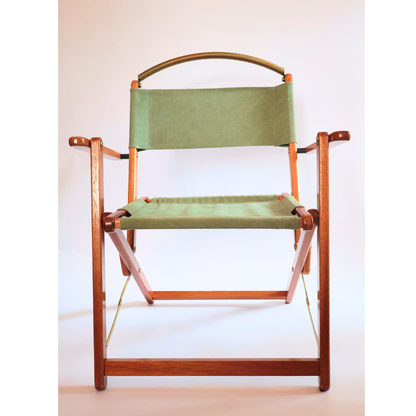 Director's chair with green fabric seat and backrest on a white background