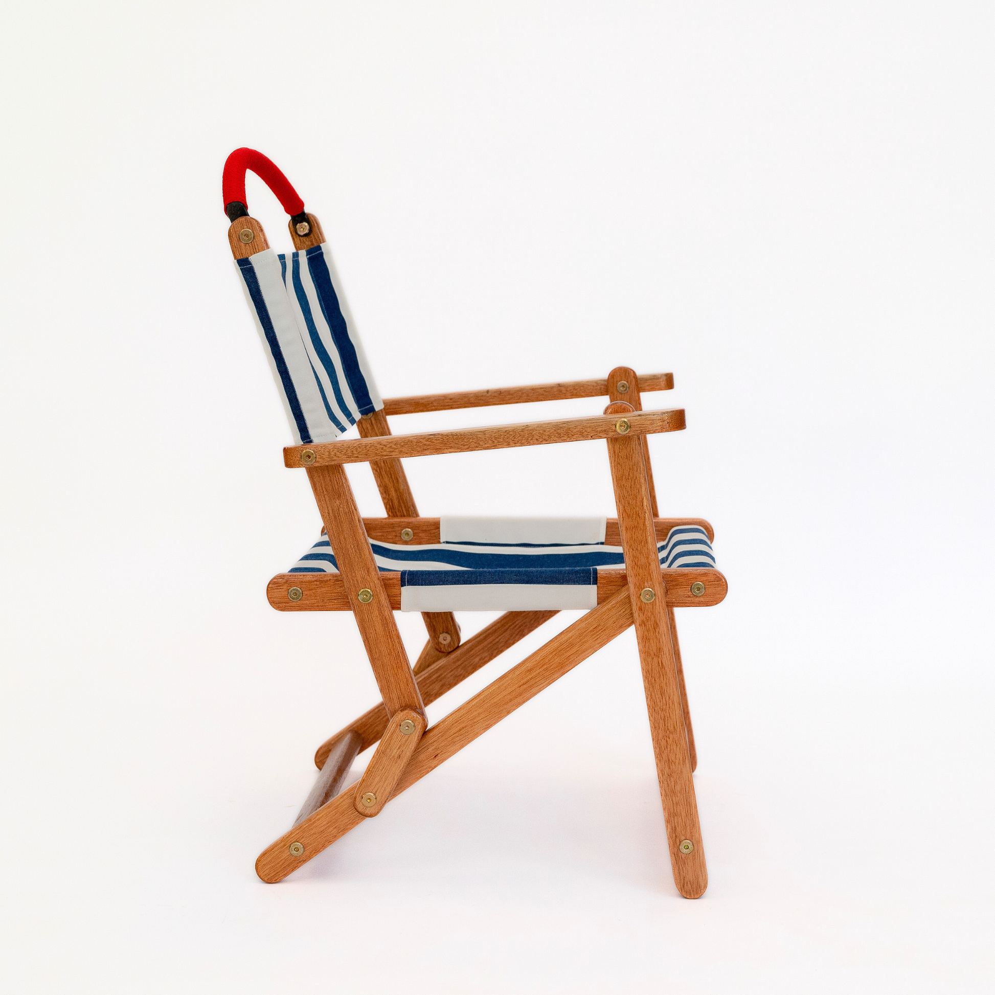 Blue and white striped folding picnic chair with red handle bar