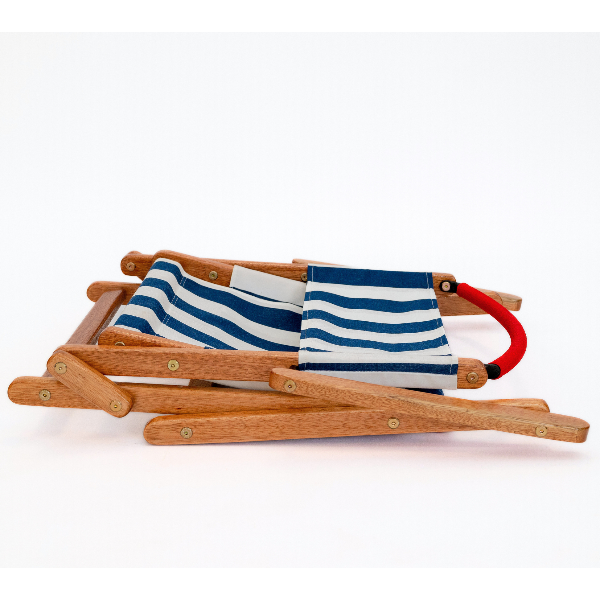 Blue and white striped folding picnic chair with red handle bar