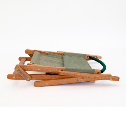 green folding camping chair